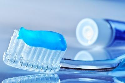 tooth brush with tooth paste on it to aid in preventative dentistry
