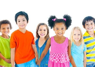 Six children smiling after seeing their Pediatric Dentist